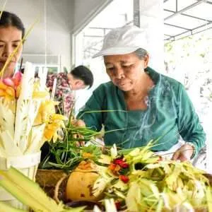 balinese women doing opening store ceremony