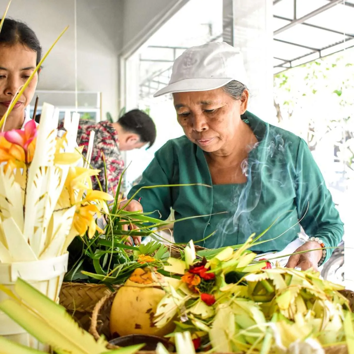 balinese women doing opening store ceremony