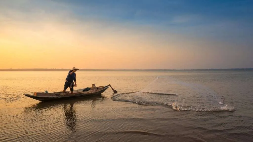 traditional fisherman fishing with net
