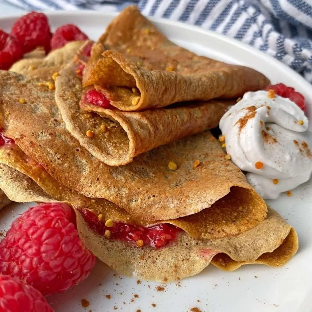 paleo nut-free sweet potato crepes with berries on the plate