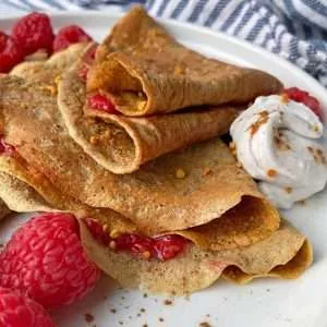 paleo nut-free sweet potato crepes with berries on the plate