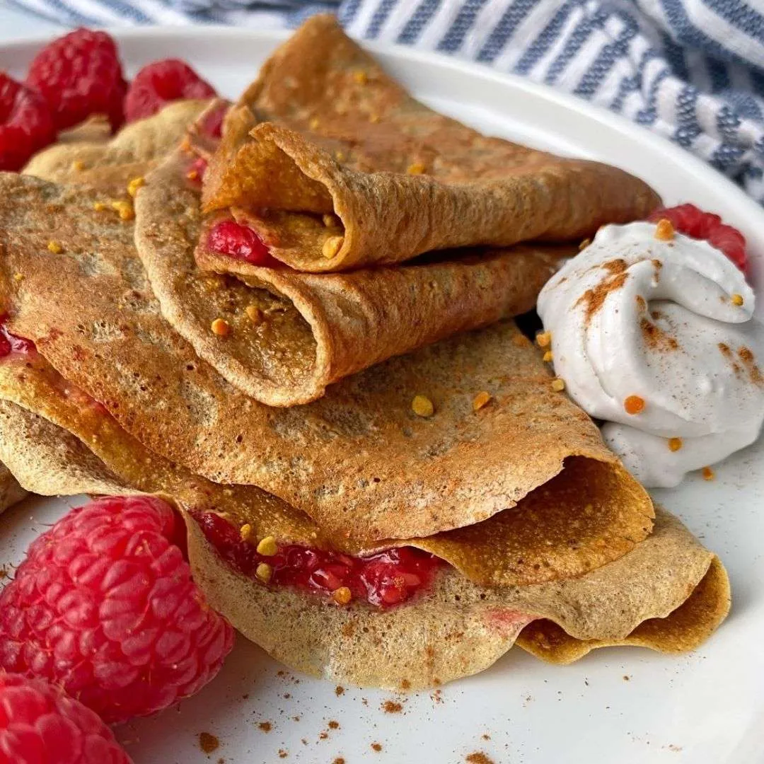 paleo nut-free sweet potato crepes with berries on the plate